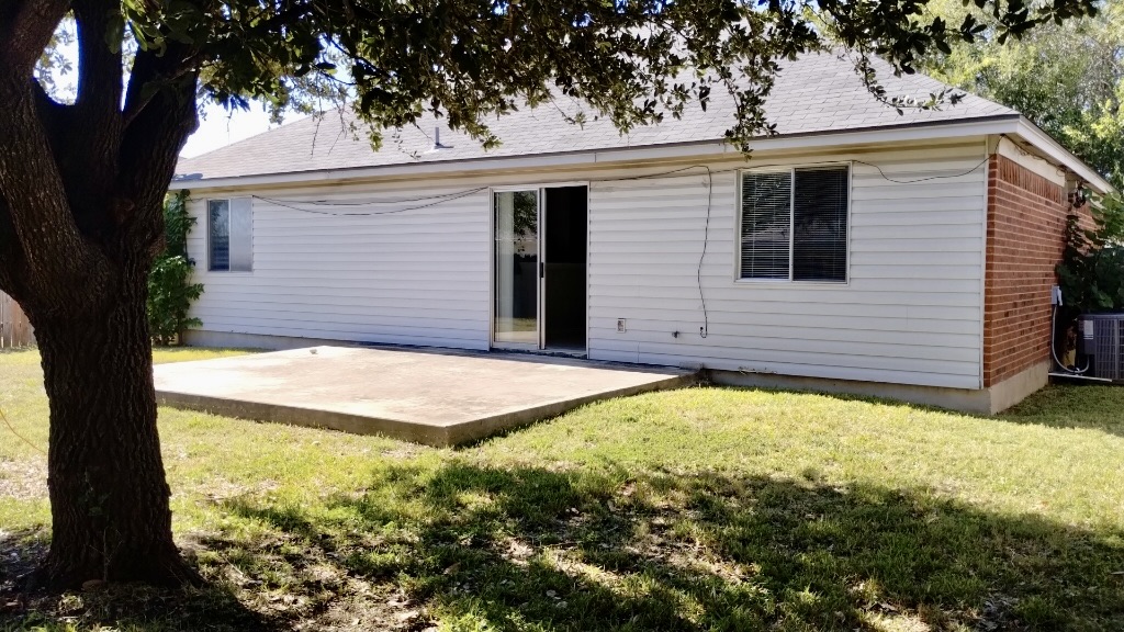 3413 Walleye Way Round Rock, TX 78665 - Photo 20 of 21 a view of a backyard with large tree