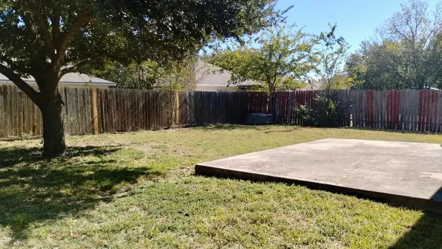 a swimming pool with wooden fence