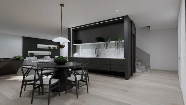 a living room with stainless steel appliances kitchen island granite countertop furniture and a flat screen tv