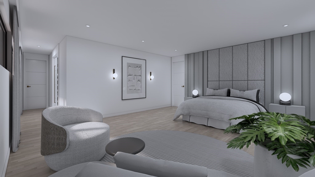 21-33 Metacomet Road Newton, MA 02468 - Photo 18 of 25 a bedroom with a bed and a couch