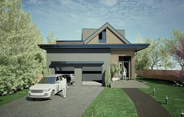 a front view of a house with a garden and plants