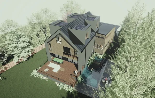 an aerial view of a house with a yard lake and trees all around