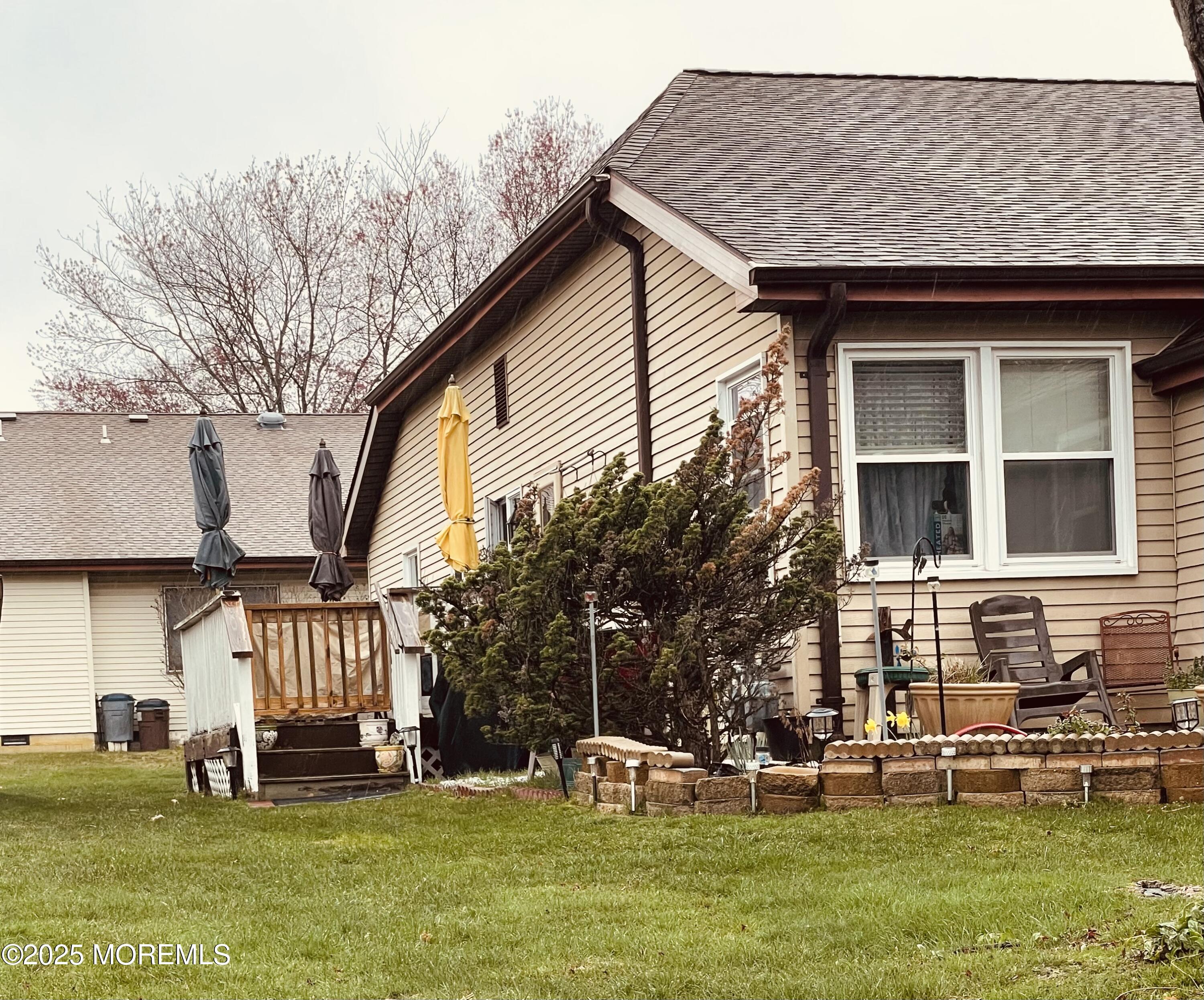 50 Sycamore Access Road Manahawkin, NJ 08050 - Photo 3 of 5 a front view of a house with a yard