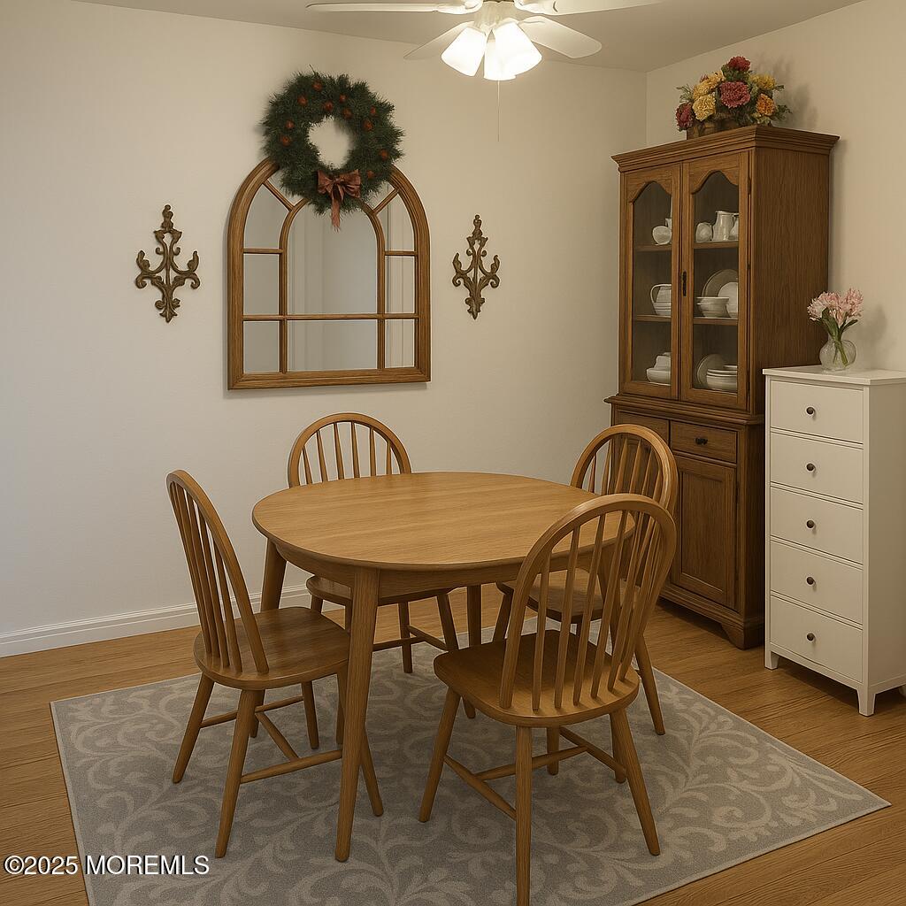50 Sycamore Access Road Manahawkin, NJ 08050 - Photo 5 of 5 a view of a dining room with furniture and chandelier