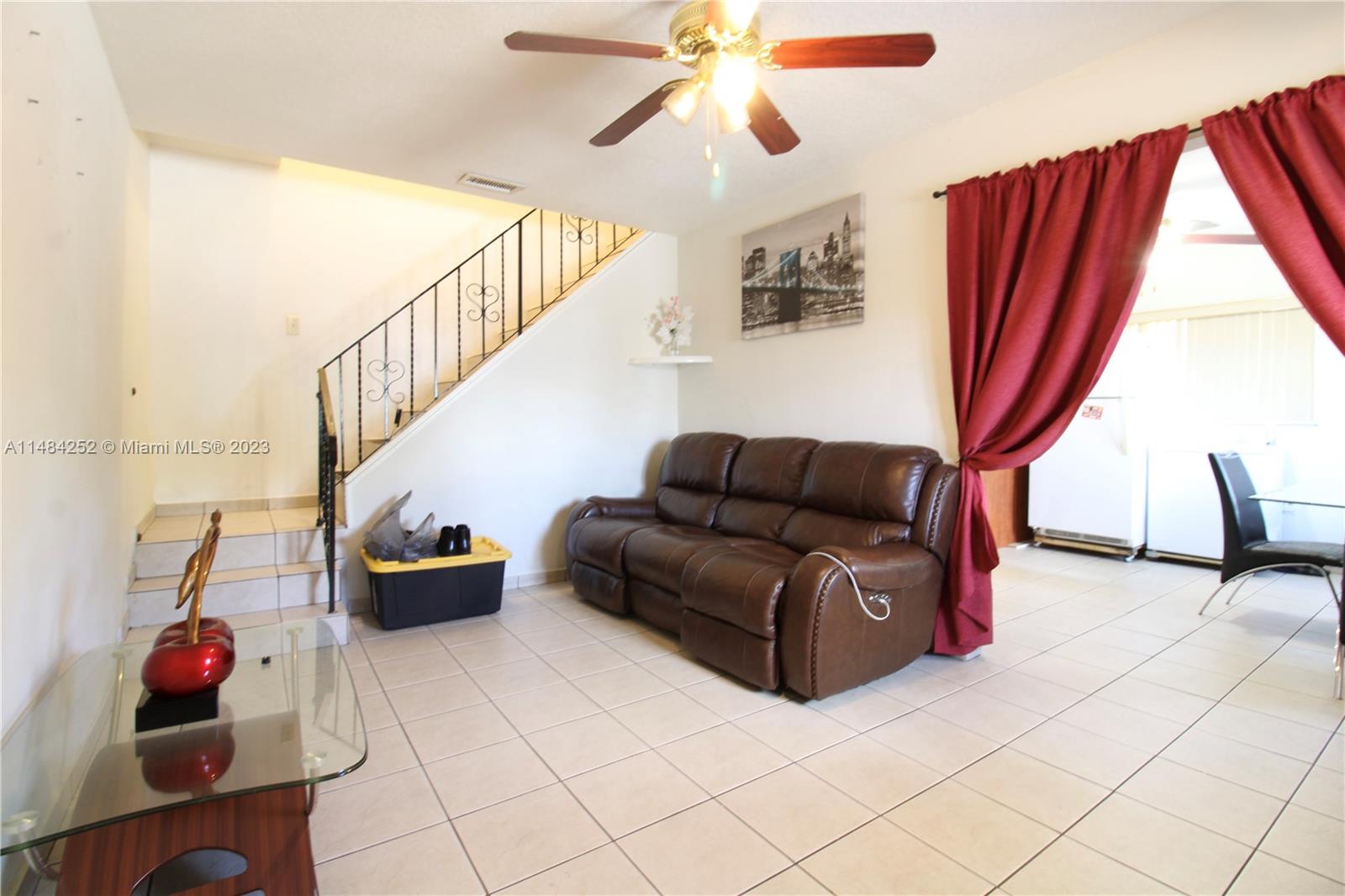 1085 West 23rd Street Hialeah, FL 33010 - Photo 22 of 32 a living room with furniture and a window