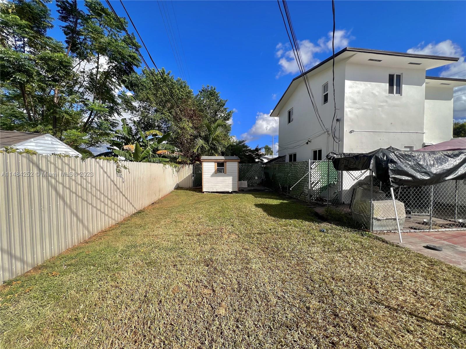 1085 West 23rd Street Hialeah, FL 33010 - Photo 26 of 32 a view of a house with backyard