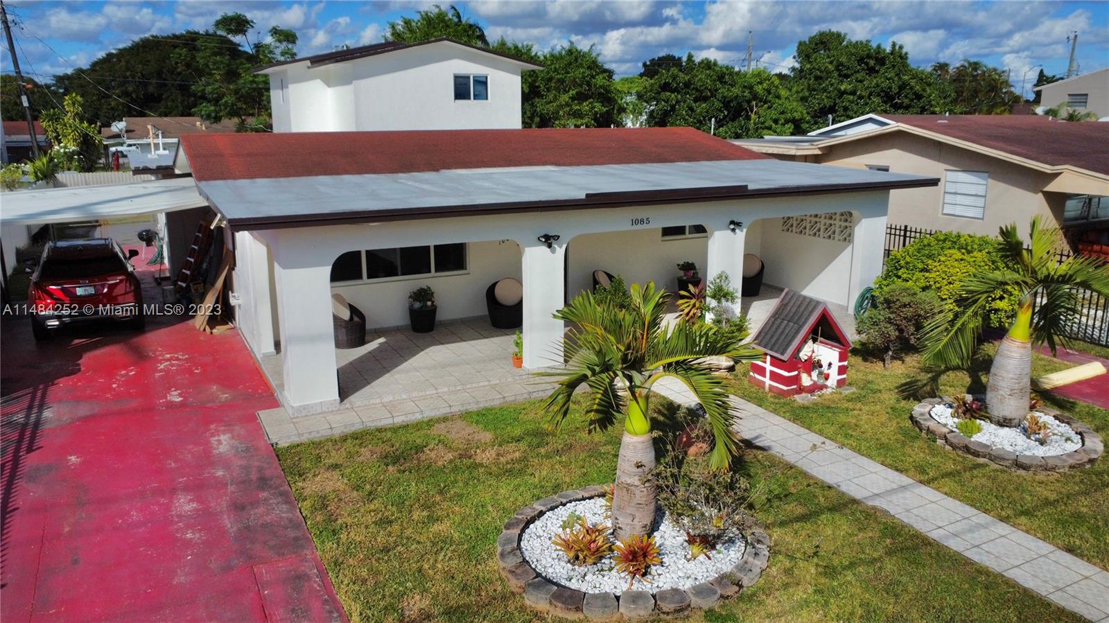 1085 West 23rd Street Hialeah, FL 33010 - Photo 27 of 32 a front view of a house with yard