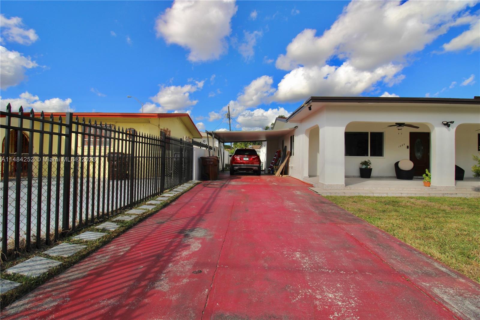 1085 West 23rd Street Hialeah, FL 33010 - Photo 28 of 32 a view of a porch and a yard