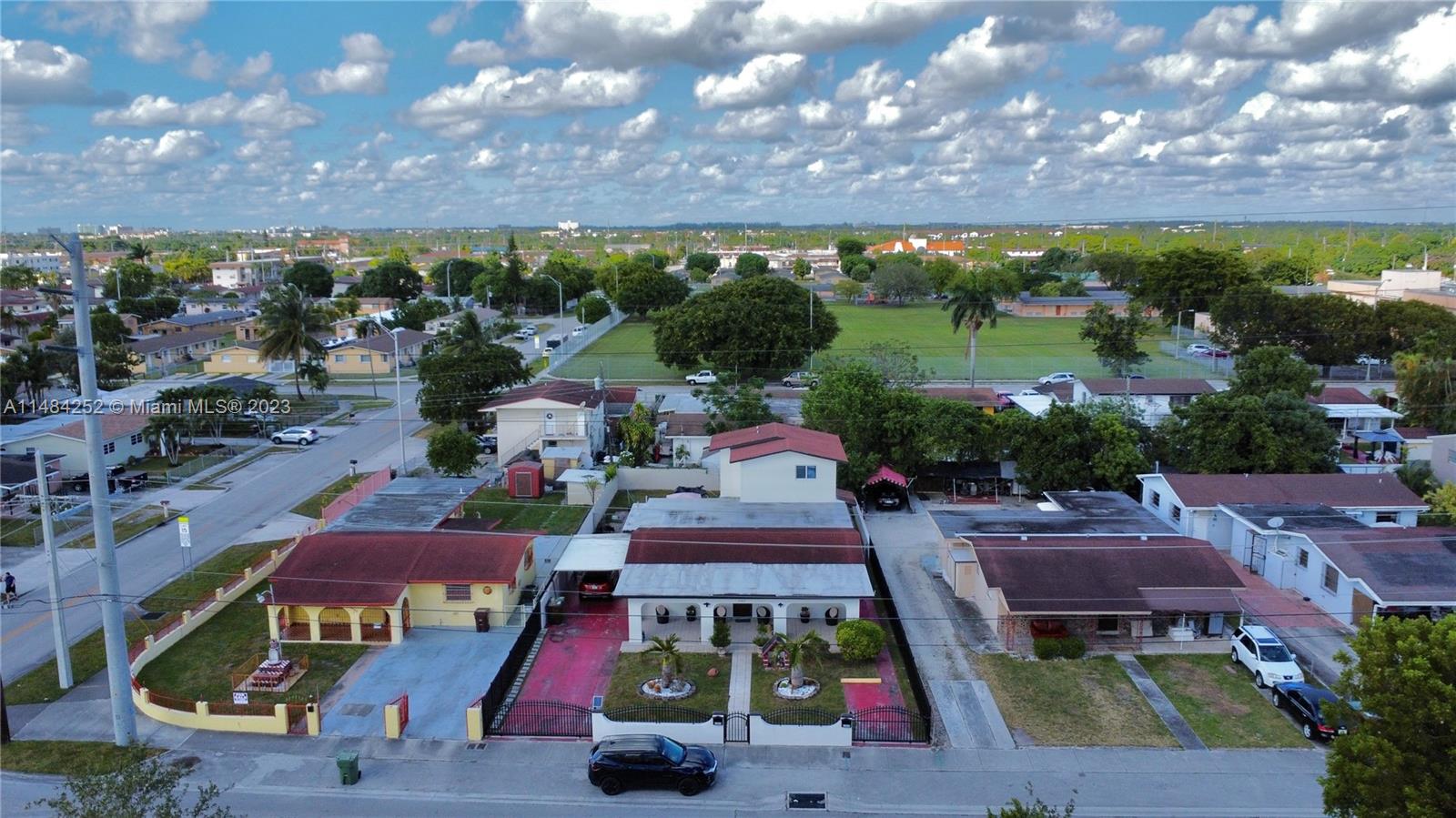 1085 West 23rd Street Hialeah, FL 33010 - Photo 29 of 32 an aerial view of multiple houses with yard