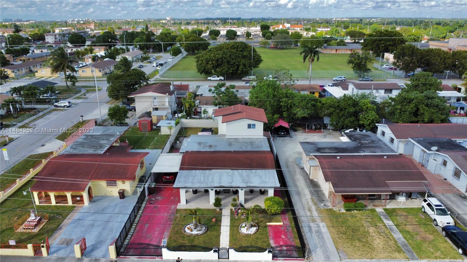 1085 West 23rd Street Hialeah, FL 33010 - Photo 30 of 32 an aerial view of houses with yard