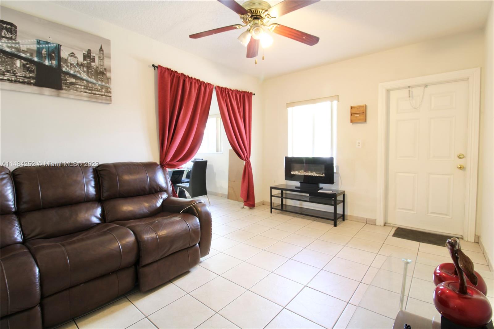 1085 West 23rd Street Hialeah, FL 33010 - Photo 6 of 32 a living room with furniture and a window