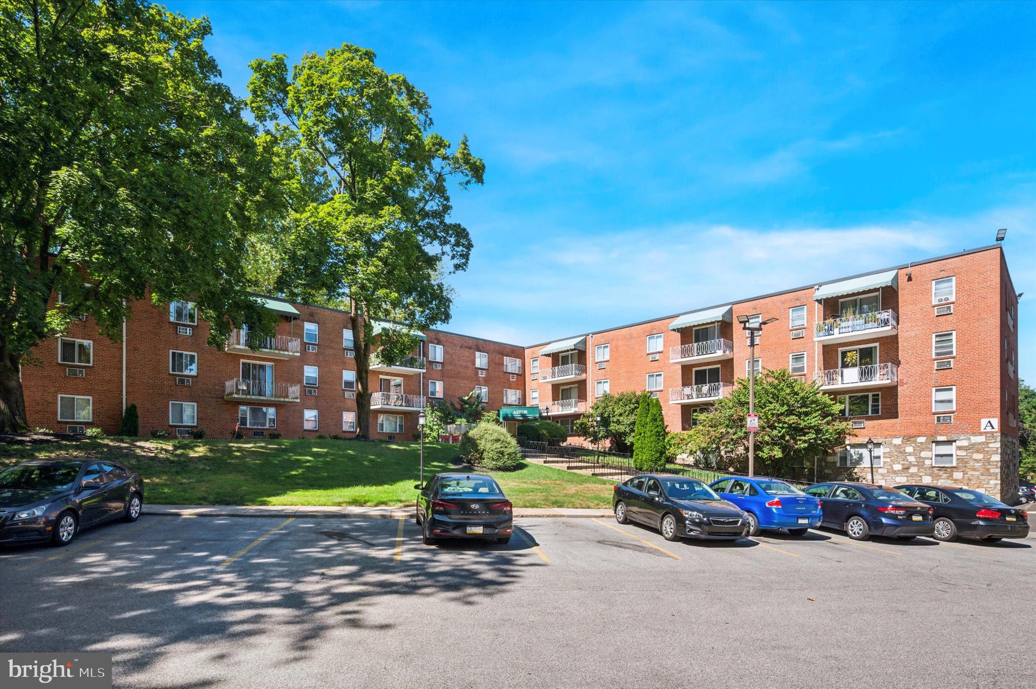 1600 Church Road, Unit A107 Wyncote, PA 19095 - Photo 1 of 15 a view of a parked cars in front of a house