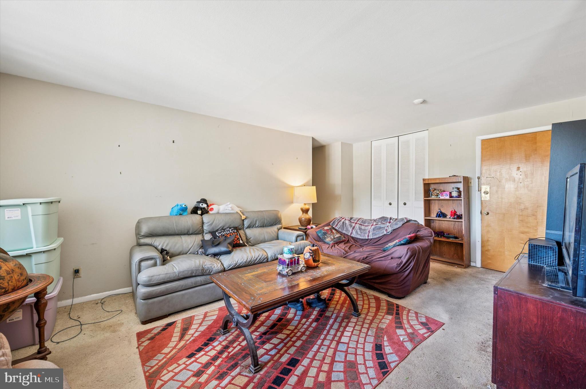 1600 Church Road, Unit A107 Wyncote, PA 19095 - Photo 2 of 15 a living room with furniture and a window