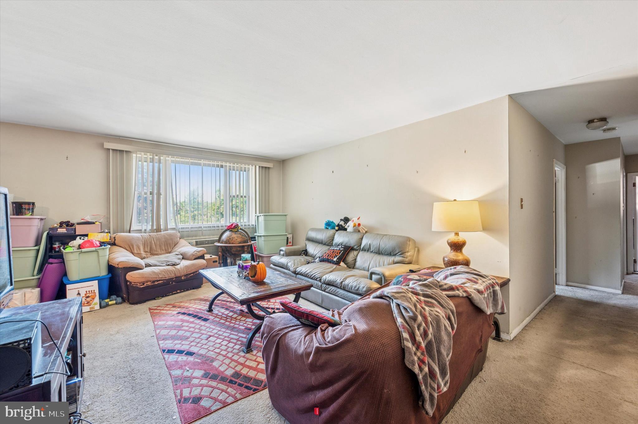 1600 Church Road, Unit A107 Wyncote, PA 19095 - Photo 3 of 15 a bed room with bed and a window