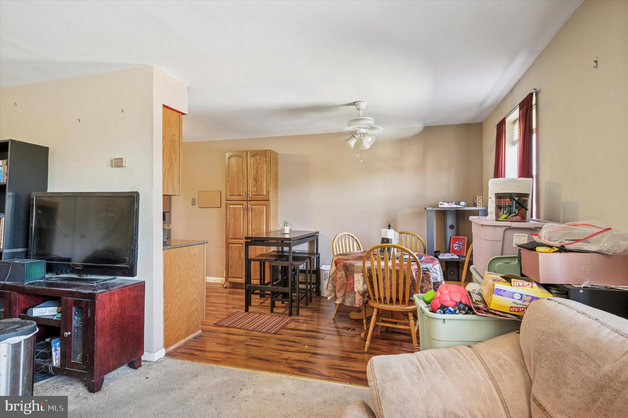 1600 Church Road, Unit A107 Wyncote, PA 19095 - Photo 9 of 15 a living room with furniture and a flat screen tv