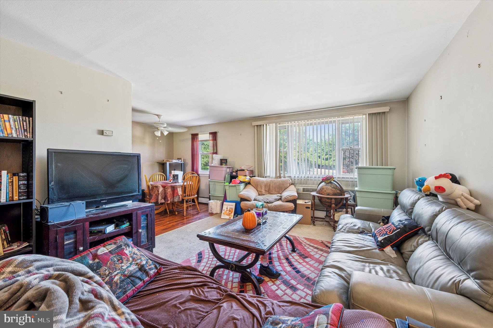 1600 Church Road, Unit A107 Wyncote, PA 19095 - Photo 10 of 15 a living room with furniture and a flat screen tv