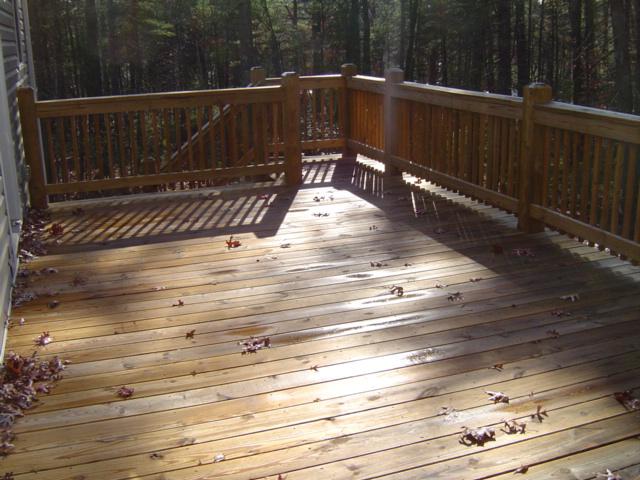 75 Shanleys Loop Ferrum, VA 24088 - Photo 21 of 21 a view of deck with wooden floor and fence next to a yard