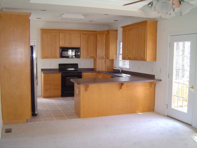 75 Shanleys Loop Ferrum, VA 24088 - Photo 7 of 21 a kitchen with stainless steel appliances granite countertop a stove a sink and a microwave
