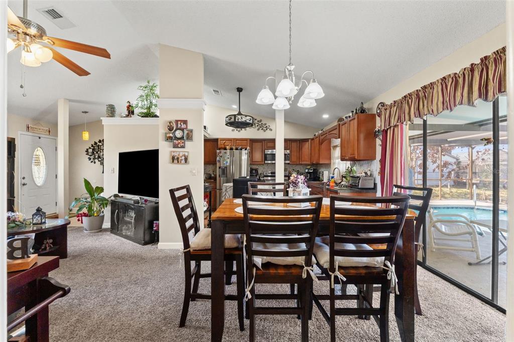 4151 Montano Avenue Spring Hill, FL 34609 - Photo 22 of 34 a view of a dining room with furniture window and outside view