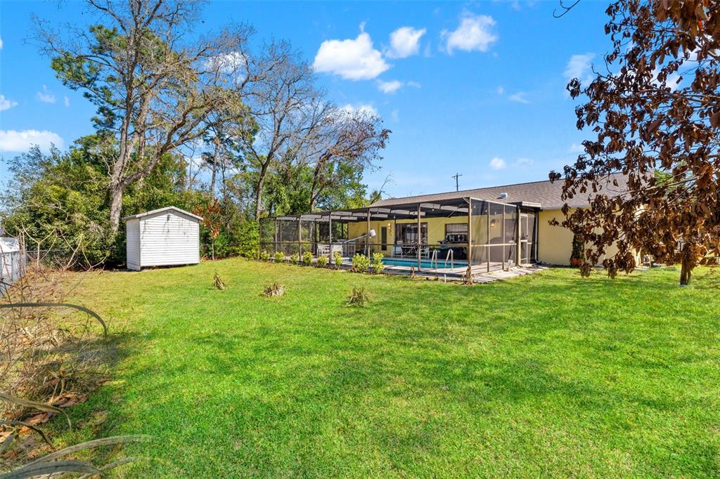 4151 Montano Avenue Spring Hill, FL 34609 - Photo 31 of 34 a front view of house with yard and green space