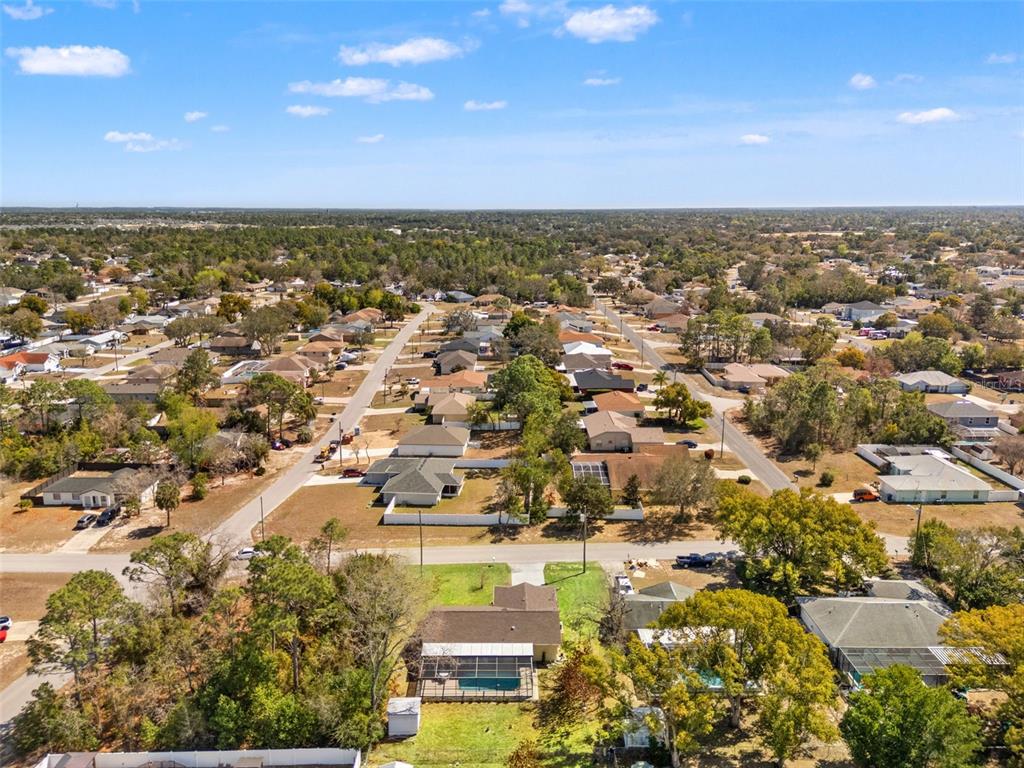4151 Montano Avenue Spring Hill, FL 34609 - Photo 7 of 34 an aerial view of residential building with green space