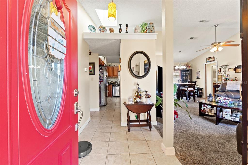 4151 Montano Avenue Spring Hill, FL 34609 - Photo 8 of 34 a living room with furniture a rug and a window