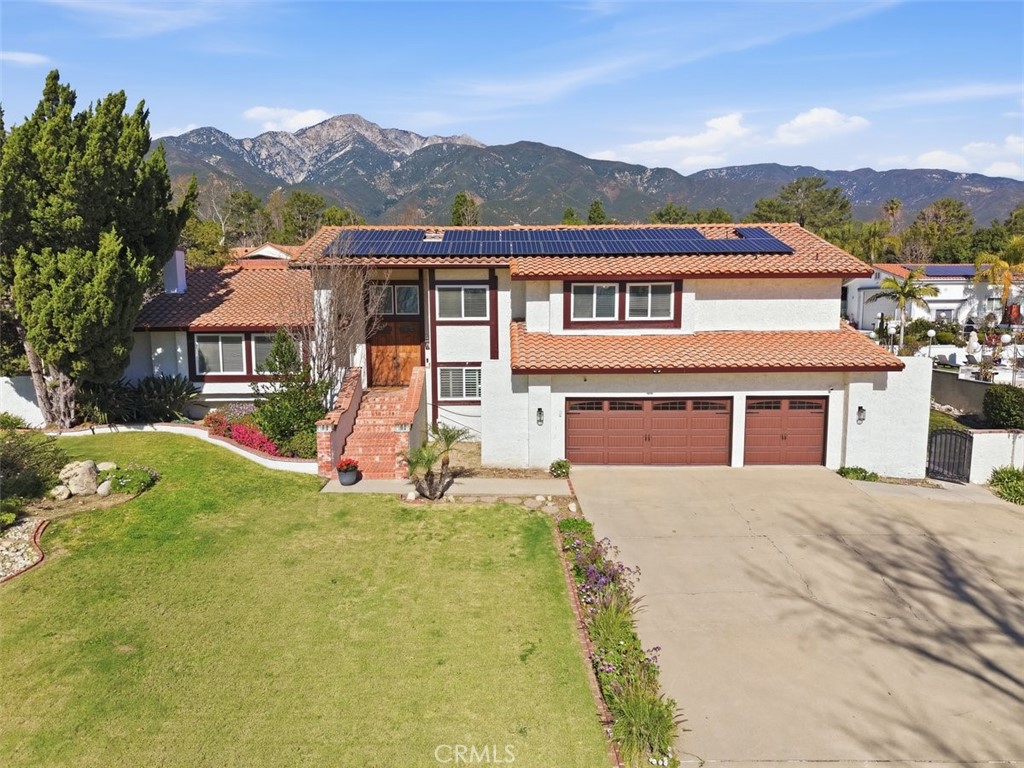 10902 Wilson Avenue Rancho Cucamonga, CA 91737 - Photo 1 of 48 a front view of house with yard and green space
