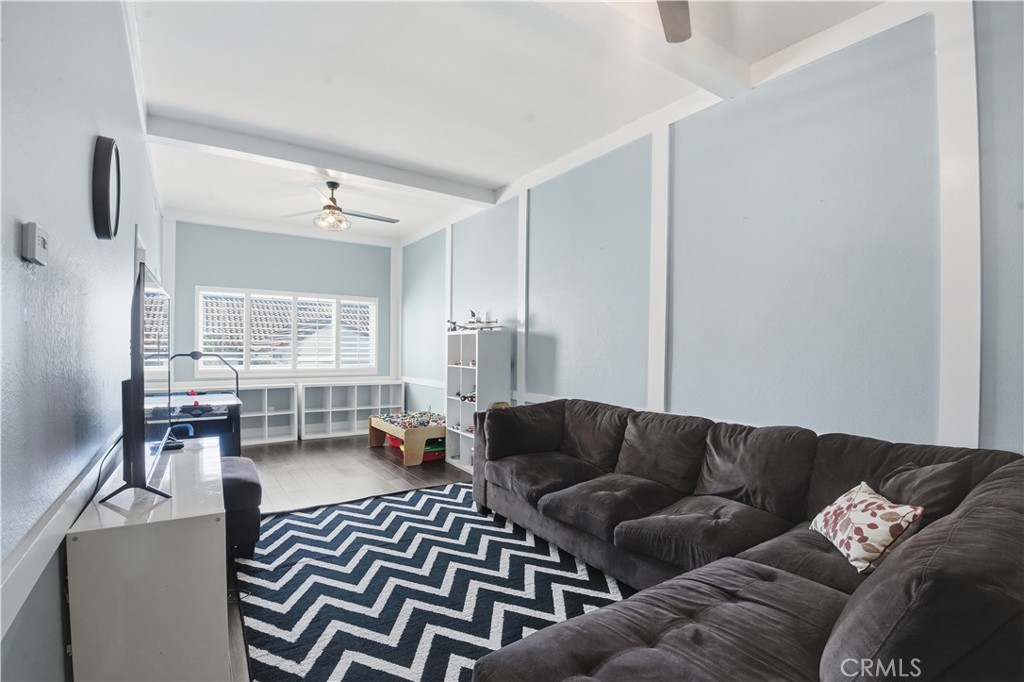10902 Wilson Avenue Rancho Cucamonga, CA 91737 - Photo 19 of 48 a living room with furniture and a large window