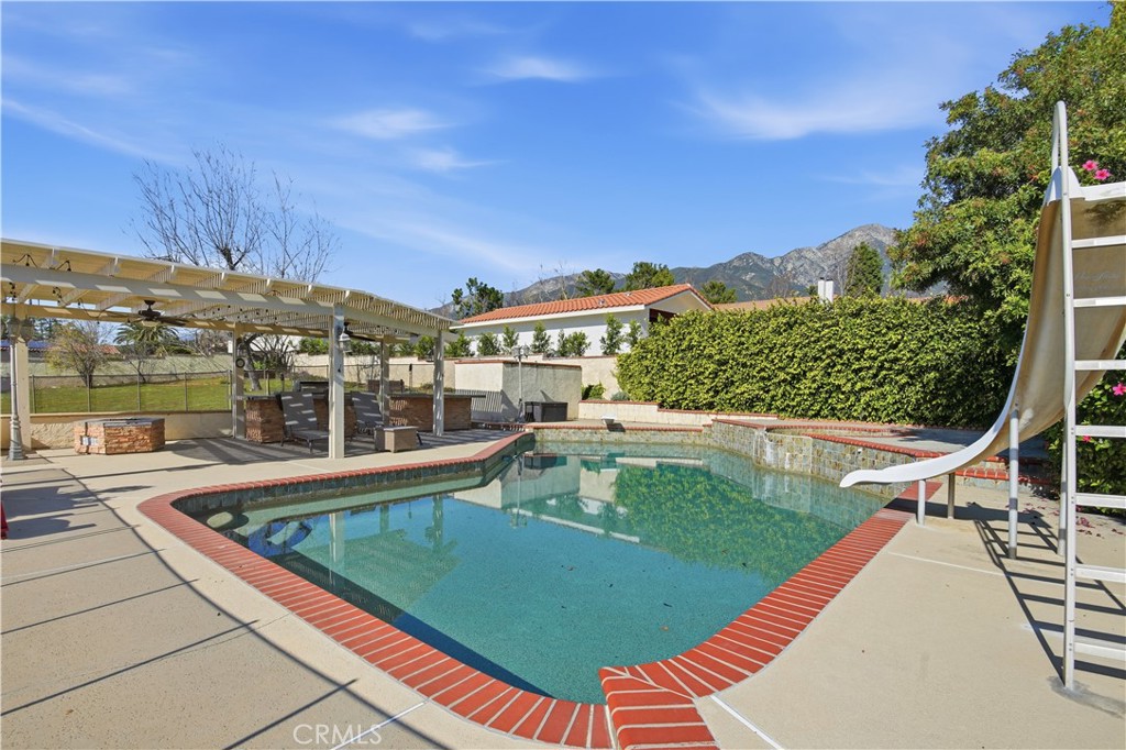 10902 Wilson Avenue Rancho Cucamonga, CA 91737 - Photo 30 of 48 a view of a swimming pool with a patio