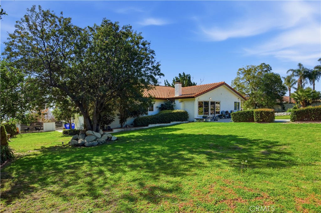 10902 Wilson Avenue Rancho Cucamonga, CA 91737 - Photo 31 of 48 a view of a house with a yard