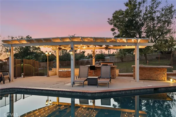 a view of a swimming pool with a patio