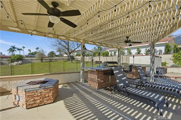a view of a patio with table and chairs with wooden floor