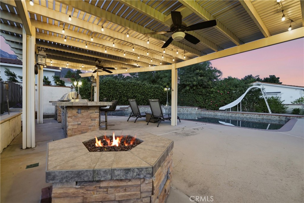10902 Wilson Avenue Rancho Cucamonga, CA 91737 - Photo 38 of 48 a view of a swimming pool with a patio