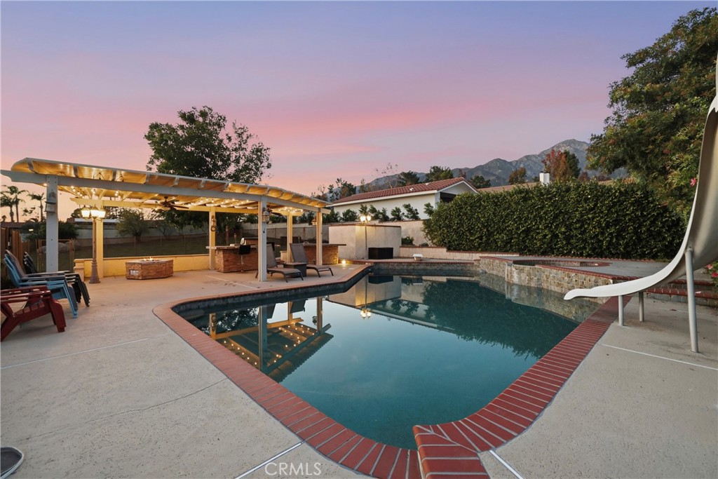 10902 Wilson Avenue Rancho Cucamonga, CA 91737 - Photo 39 of 48 a view of a swimming pool with a lounge chair