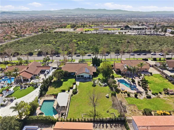 an aerial view of residential houses with outdoor space