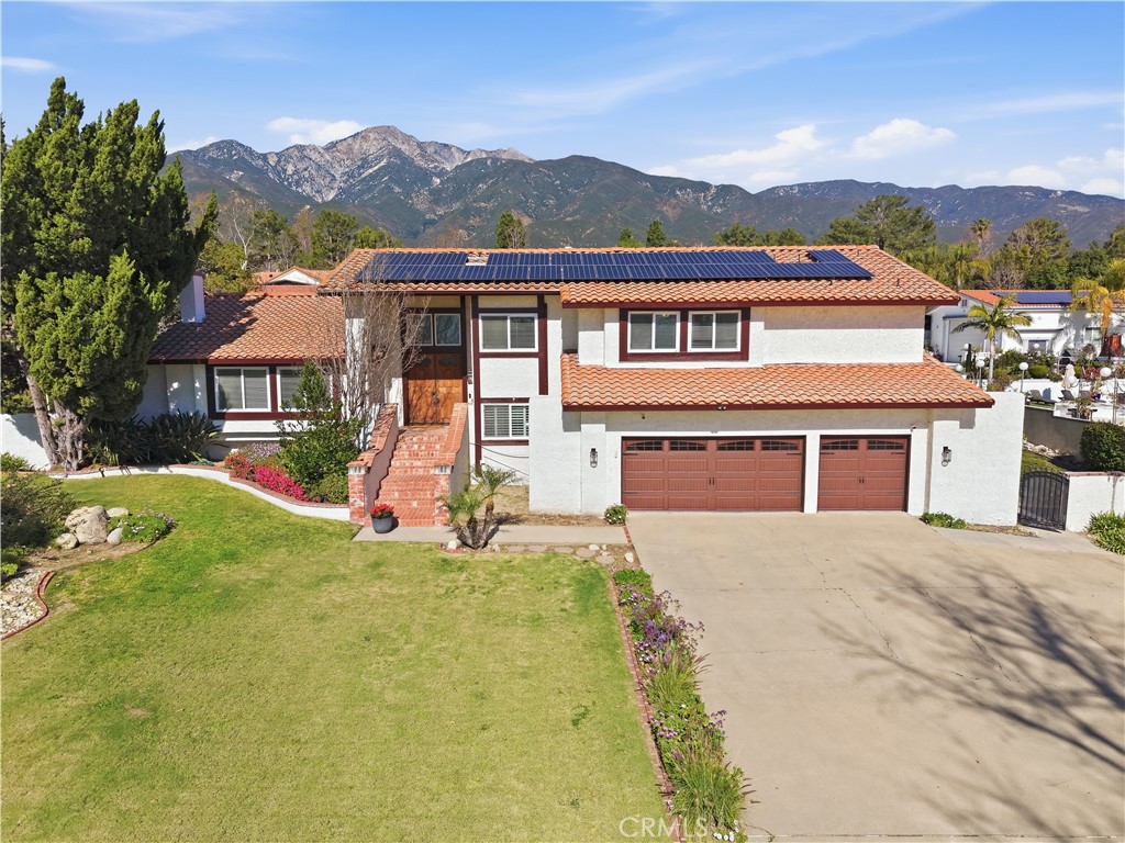 10902 Wilson Avenue Rancho Cucamonga, CA 91737 - Photo 47 of 48 a front view of house with yard and green space