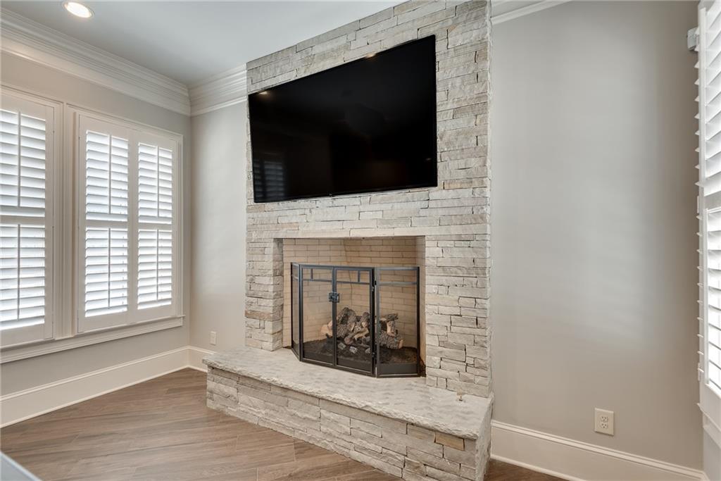 187 Fontaine Road Southwest Mableton, GA 30126 - Photo 62 of 84 a living room with a fireplace and a flat screen tv