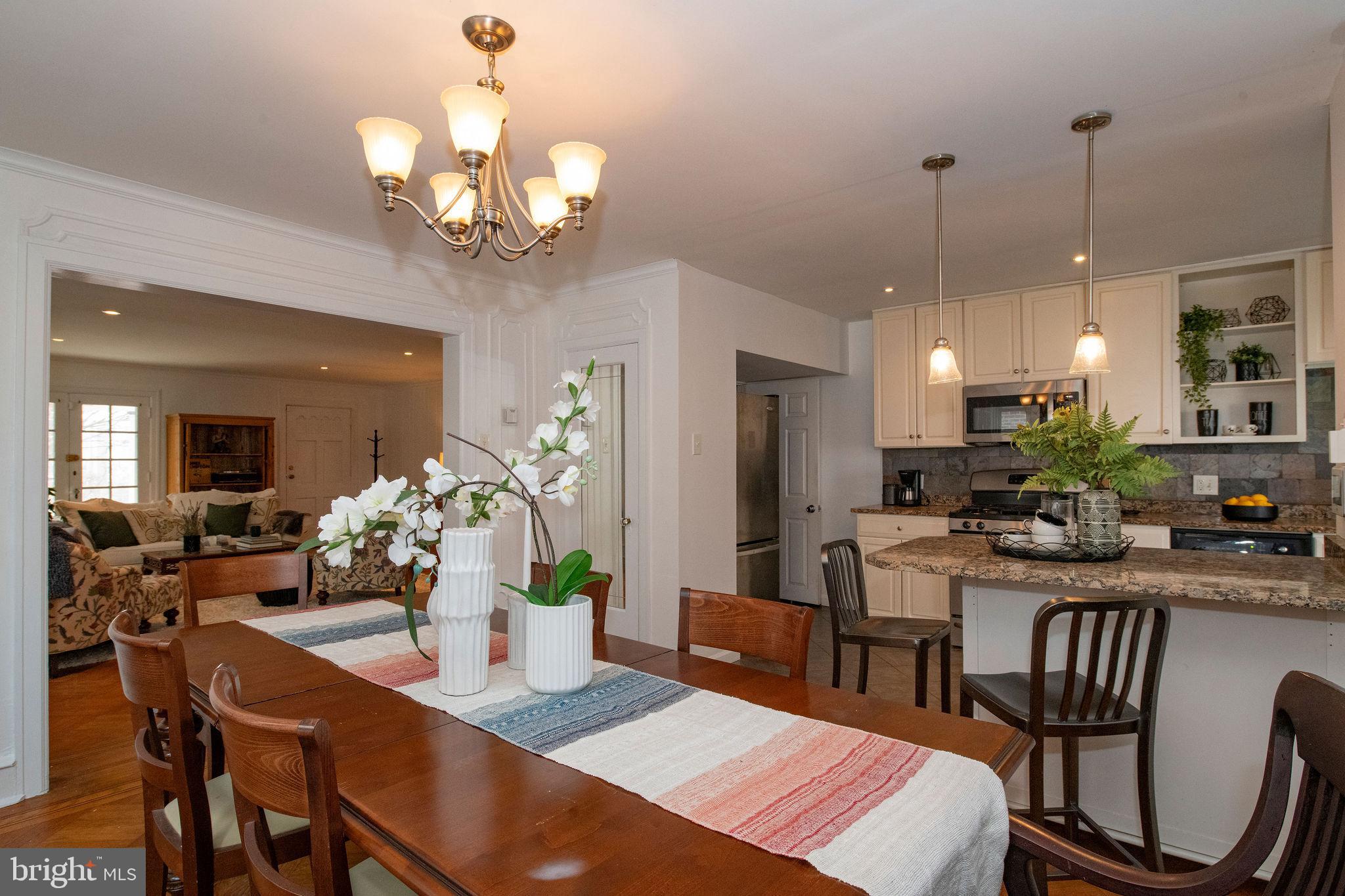 467 West Ellet Street Philadelphia, PA 19119 - Photo 11 of 39 a dining room filled chandelier and kitchen view