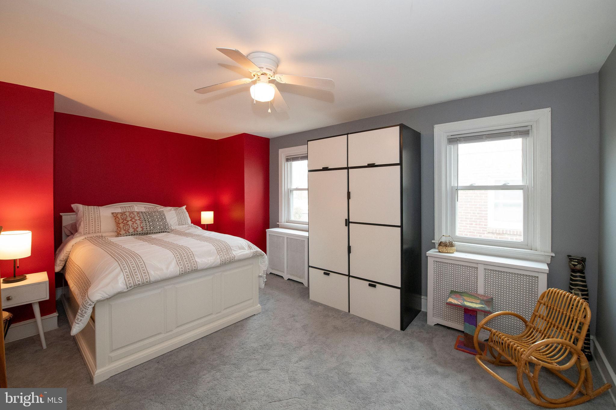 467 West Ellet Street Philadelphia, PA 19119 - Photo 20 of 39 a bedroom with a bed and a chandelier