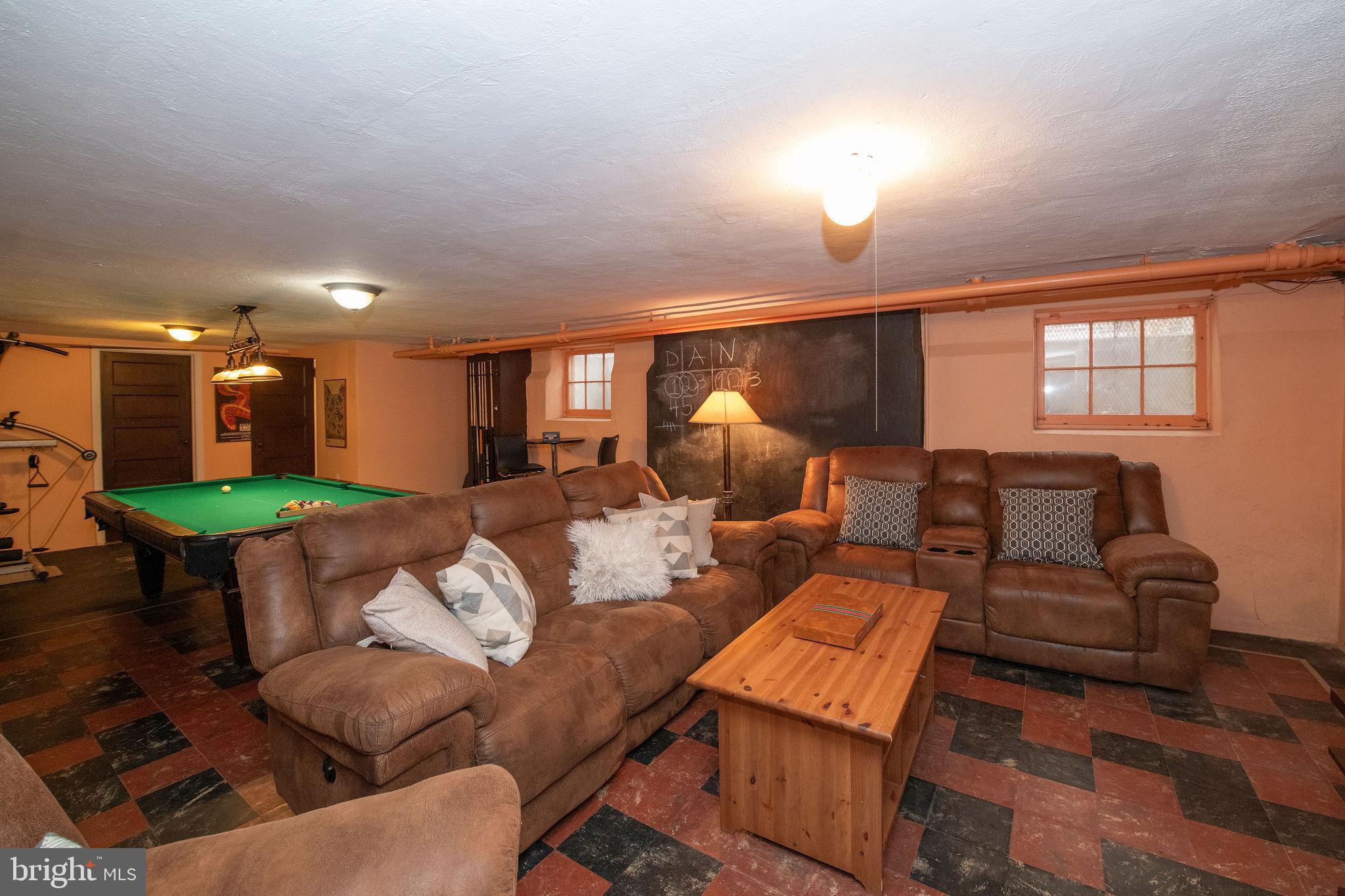 467 West Ellet Street Philadelphia, PA 19119 - Photo 30 of 39 a living room with furniture and a wooden floor