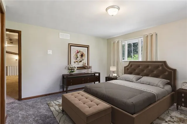 a bedroom with a bed and a table