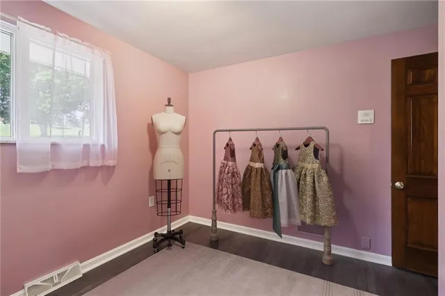 a bathroom with a granite countertop sink a large mirror and a shower