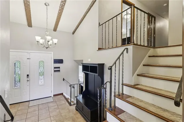 a view of a hallway with stairs
