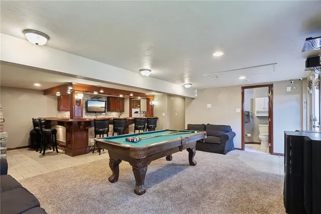 a room with furniture and view kitchen