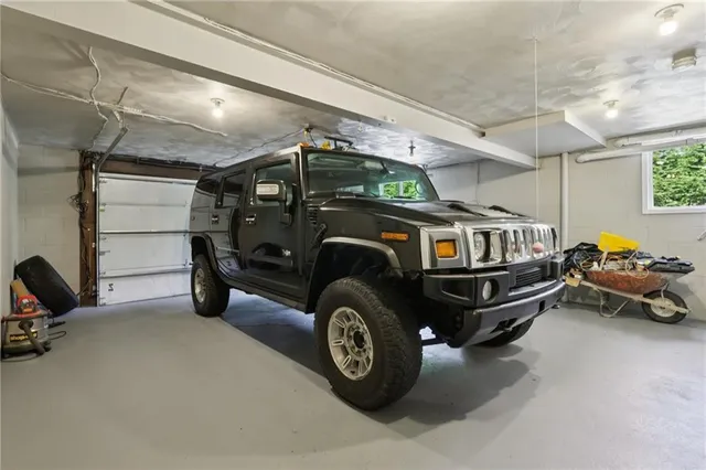 a view of a garage with cars