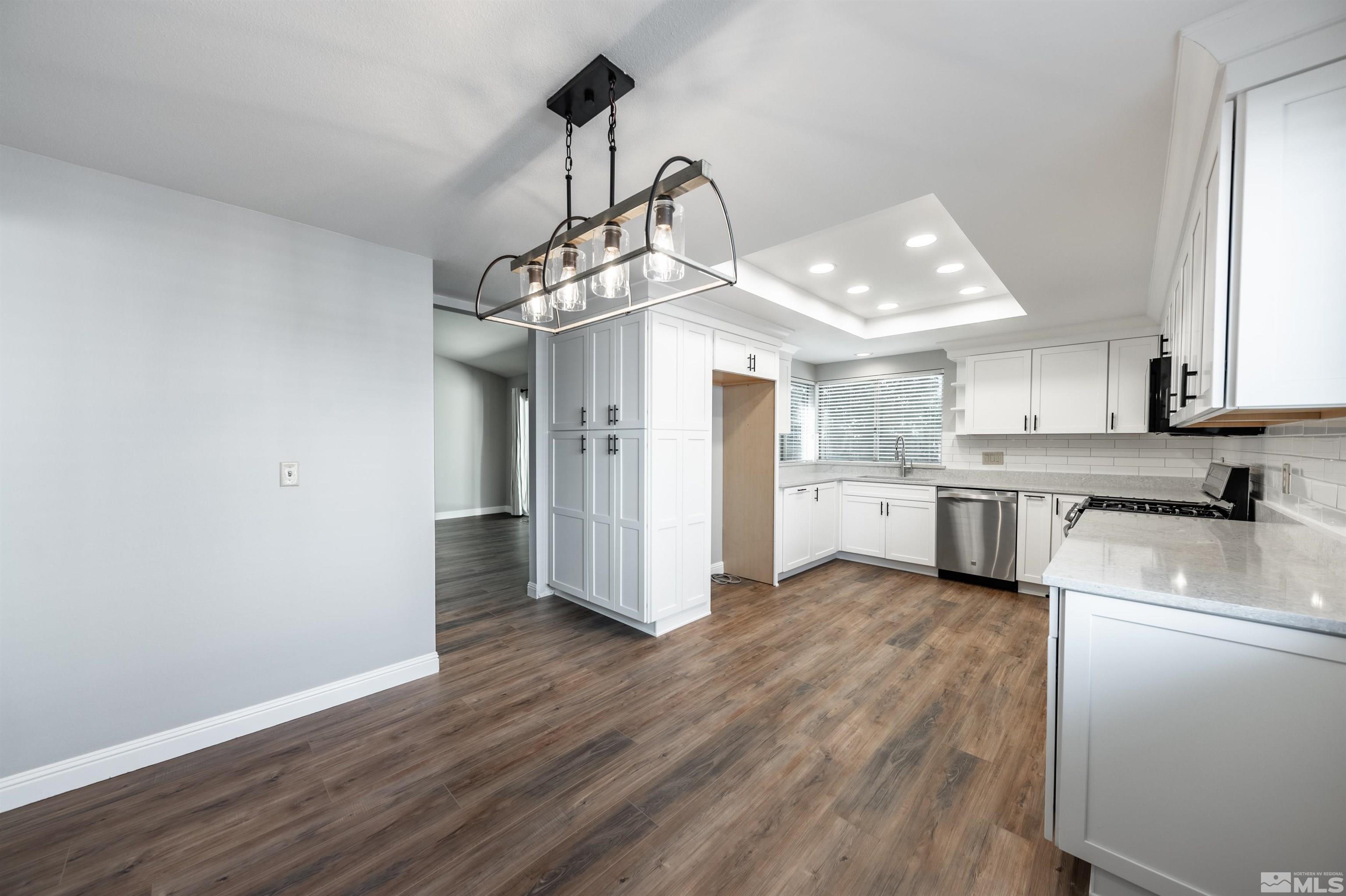 4795 Warren Way Reno, NV 89509 - Photo 12 of 40 a view of a kitchen with wooden floor