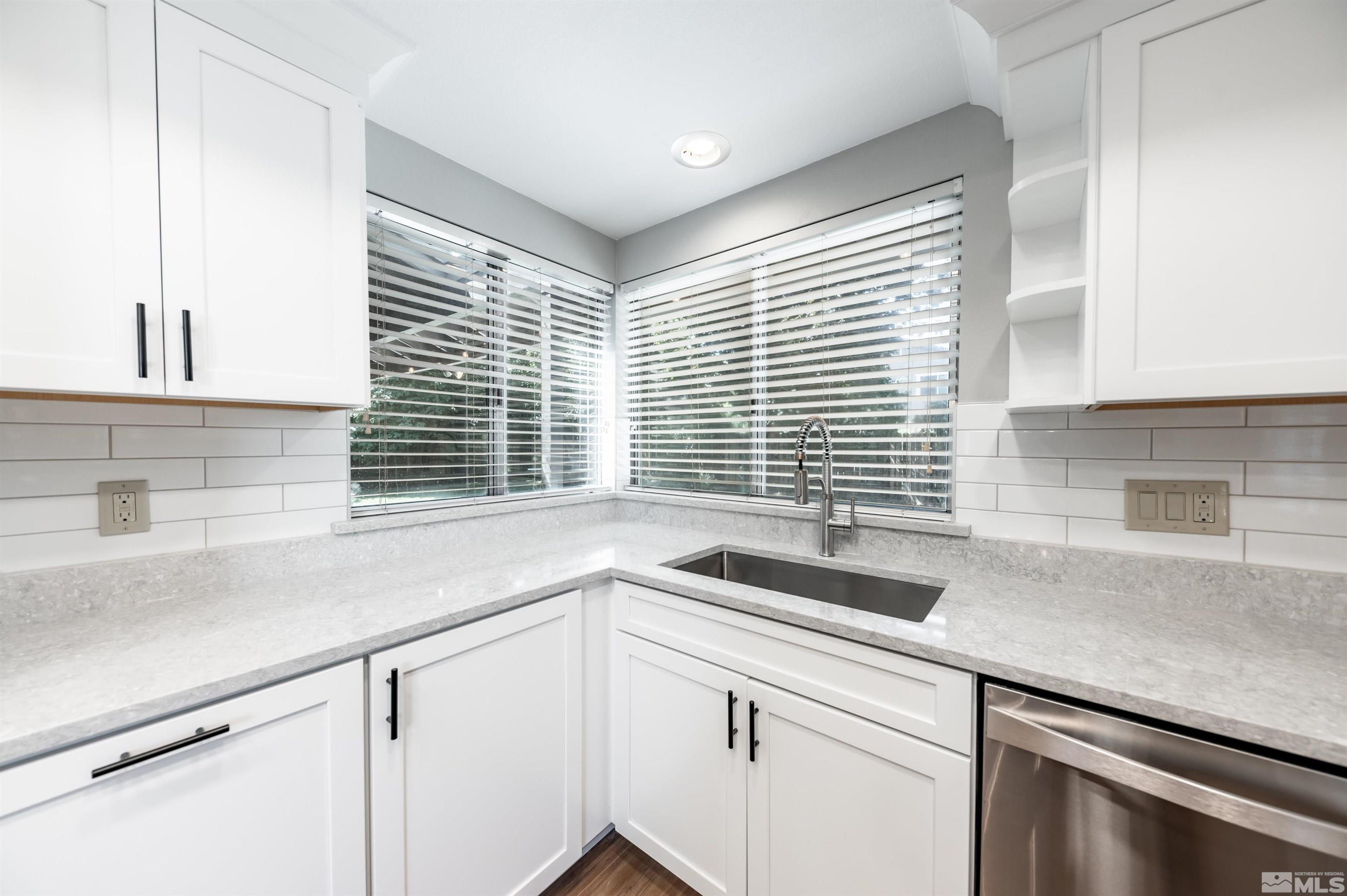 4795 Warren Way Reno, NV 89509 - Photo 14 of 40 a kitchen with a sink and a window