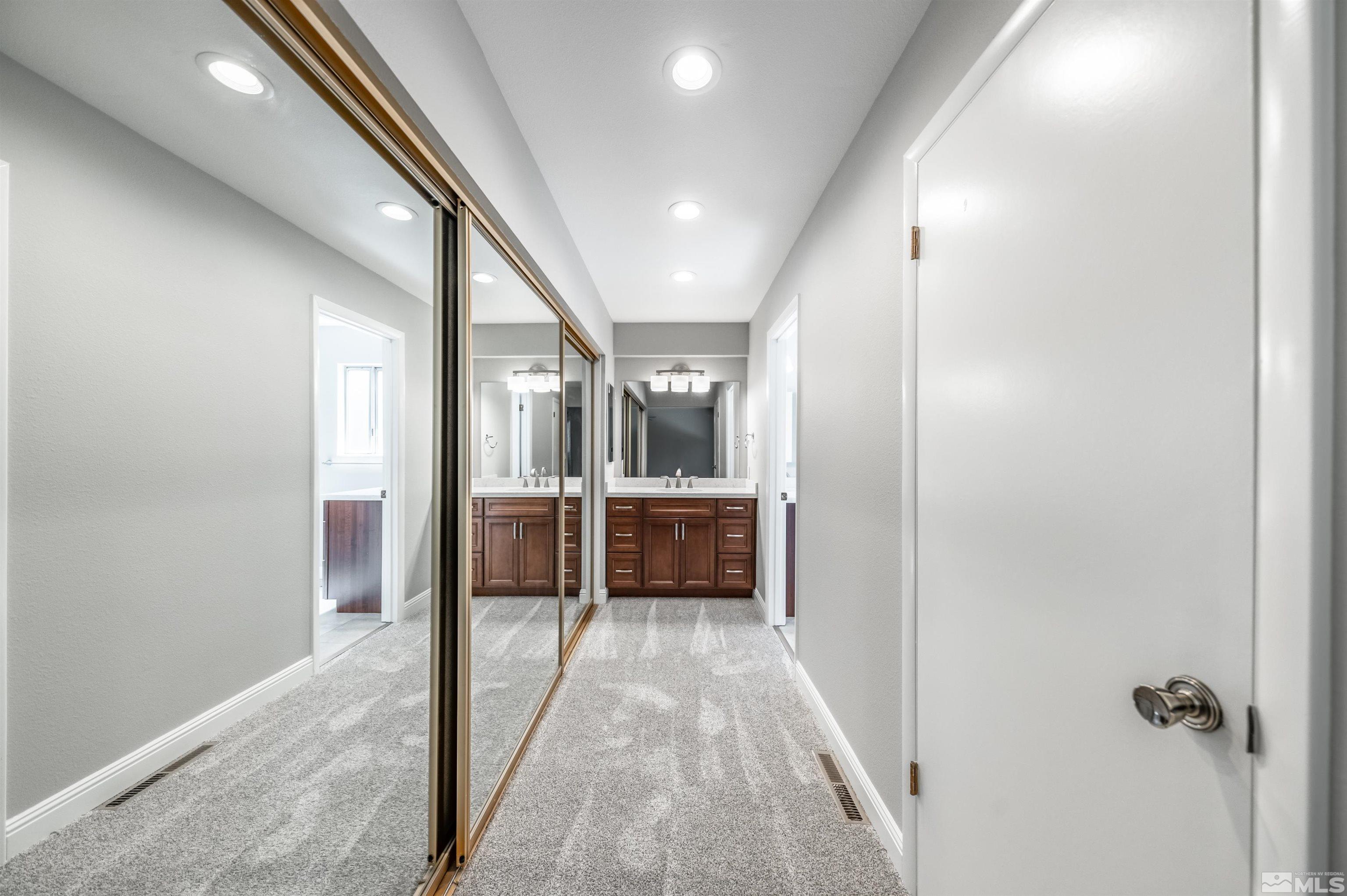 4795 Warren Way Reno, NV 89509 - Photo 17 of 40 a view of a hallway with white doors