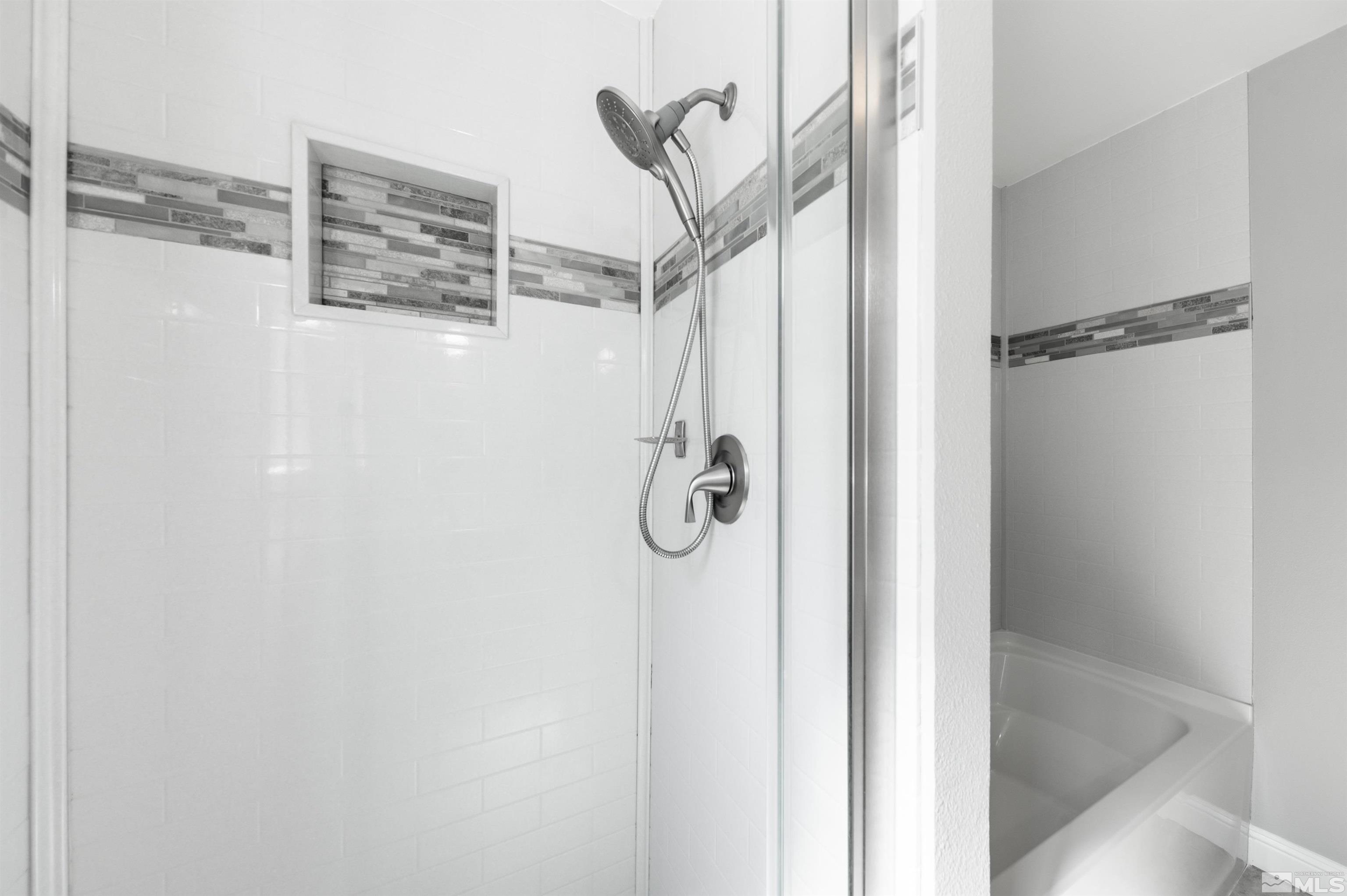 4795 Warren Way Reno, NV 89509 - Photo 20 of 40 a bathroom with a shower