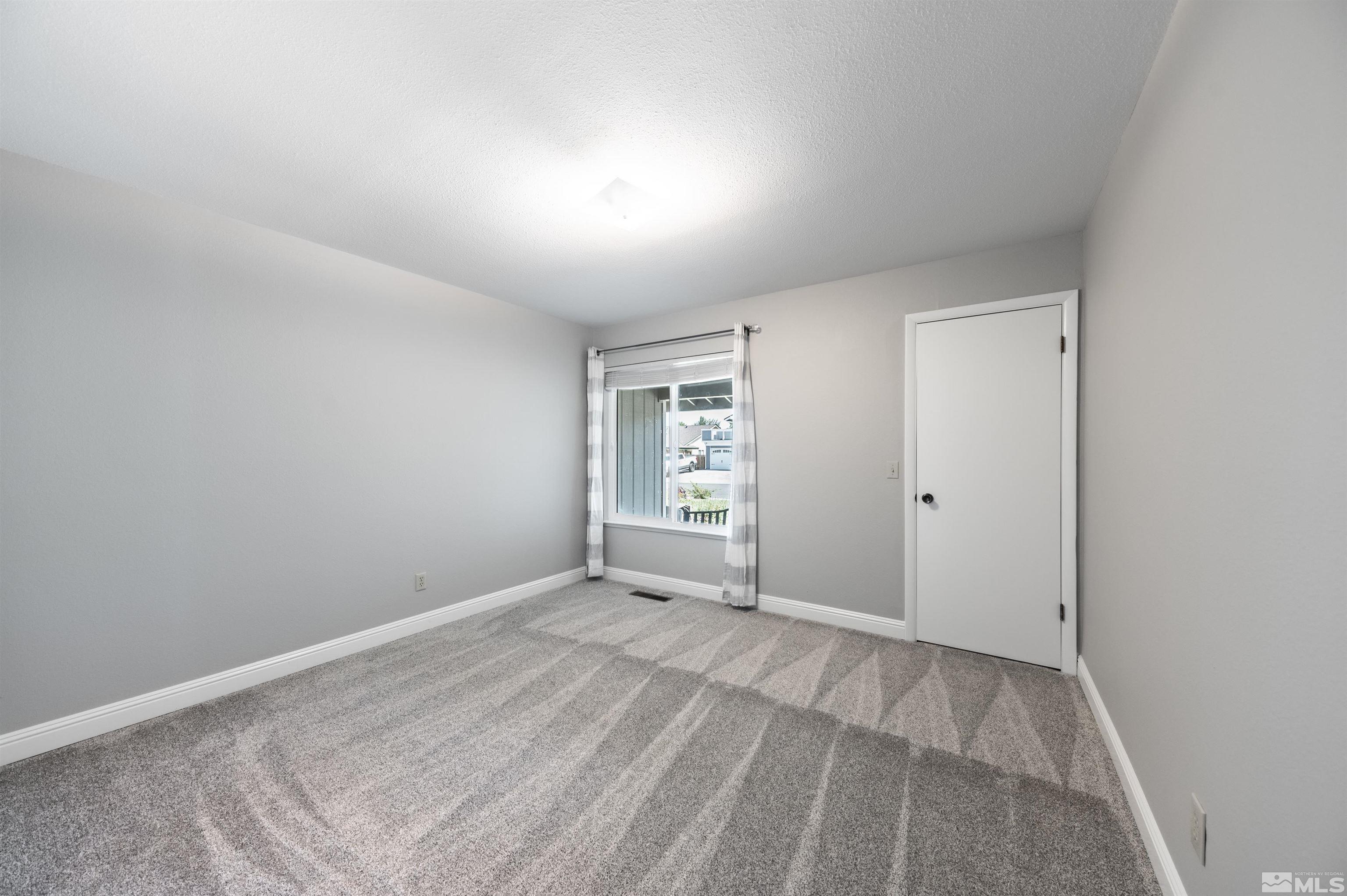 4795 Warren Way Reno, NV 89509 - Photo 22 of 40 a view of room with window
